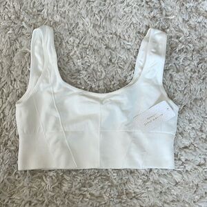 White sports bra that can also be worn on its own. Size small. Never been worn!